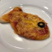 Goldfish Shaped Mini Pizzas - single goldfish shaped pizza own a white plate