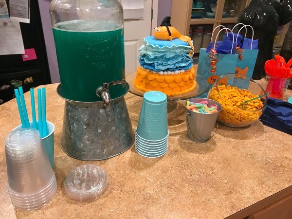 Goldfish Themed Party Snacks - island with cake, punch, snacks, and cups