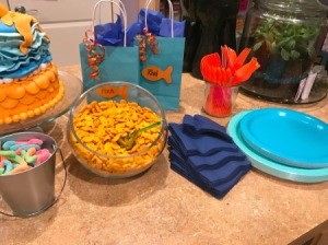 Goldfish Themed Party Snacks - napkins and plates along with partial of cake and snacks