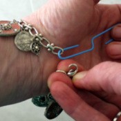 Fastening a Bracelet - using a paperclip to hold jump ring to fasten