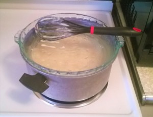 A pie plate being used as a makeshift pot lid.