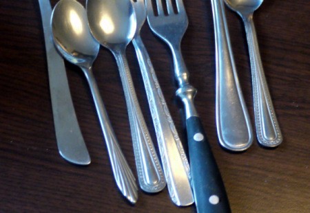 A collection of mismatched silverware.
