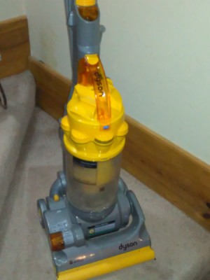 A Dyson vacuum cleaner on a staircase.