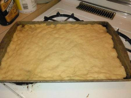 Homemade Pizza dough on cookie sheet
