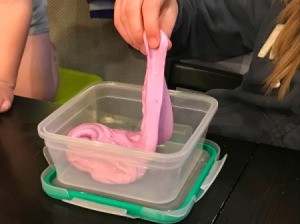 Homemade Flubber - plastic storage bowl with pink flubber