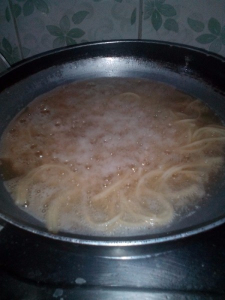 Deep frying spaghetti noodles.