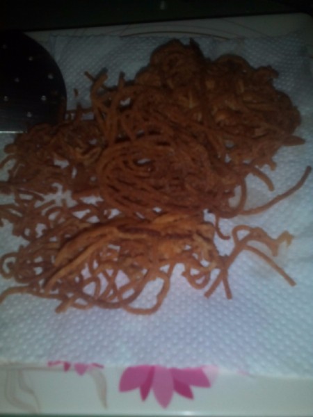 Crunchy cooked spaghetti noodles.