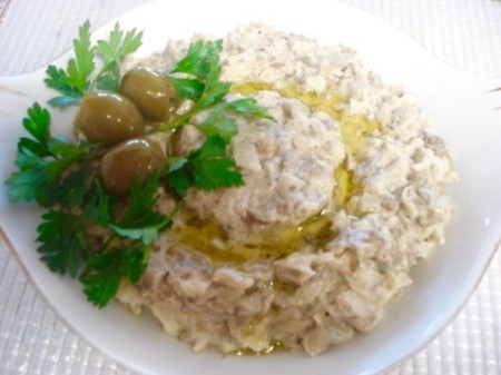 Baba Ganoush in bowl with garnish.