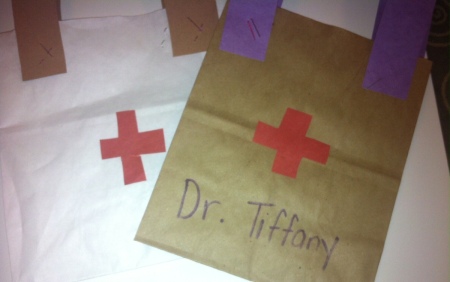 Doctor's Bag Craft - cut out red crosses for bags and glue in place
