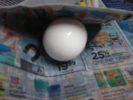 egg on newspaper