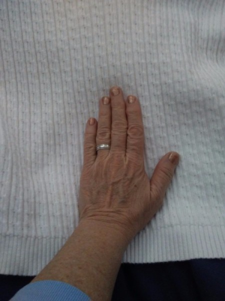 Cozy Mittens from Sweater - trace hands on bottom of sweater including the ribbing