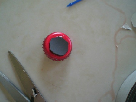 Snowman Refrigerator Magnet - cut a circle of the magnetic tape and attach to the bottle cap on the sticky side