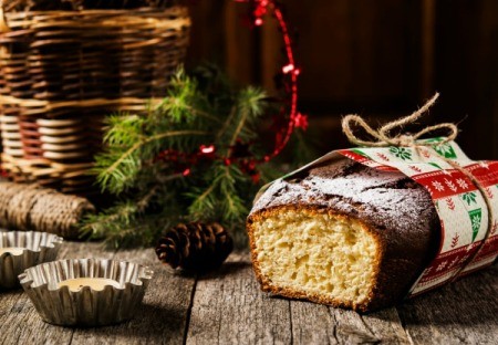 Wrapped bread surrounded by sprigs of green.