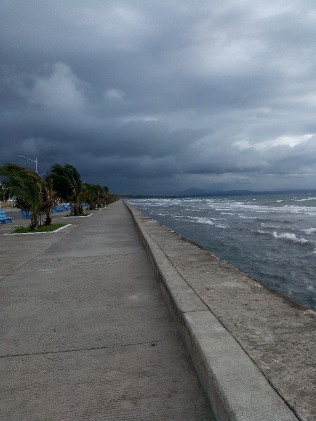 A shoreline with a storm coming in.