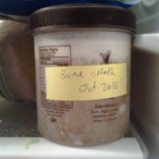 jar labeled as bone broth in the freezer
