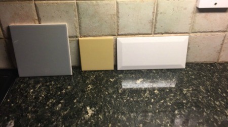 Kitchen Wall Paint Colour Advice - three tile samples against wall
