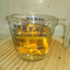Reuse Vinegar for Cleaning Jobs - cup of vinegar and water in the dirty microwave