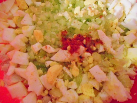 chopped eggs, chicken and celery with spices before mixing