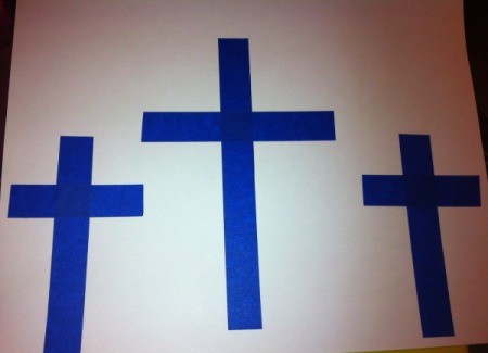 How to Make Cross Silhouettes - three crosses of tape on white paper