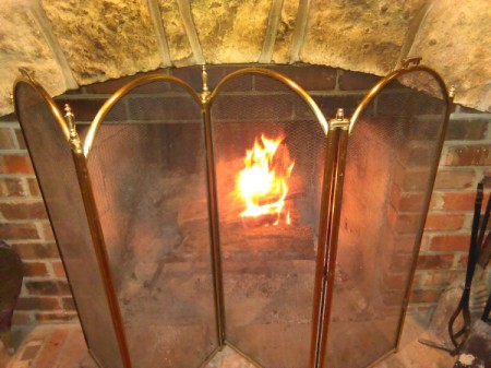 A fireplace with a screen