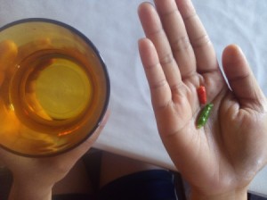 A couple of small chillies and a glass of water.