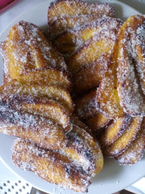 Fan fried bananas on plate.