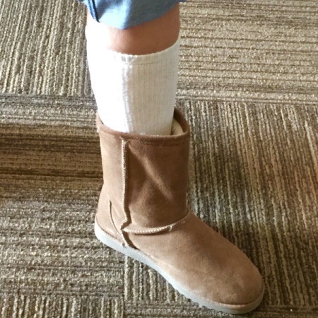 Socks and boots on a leg.