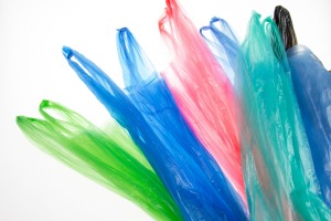 Multicolored plastic bags on a white background.