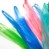 Multicolored plastic bags on a white background.