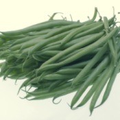 A pile of green beans on a light background.