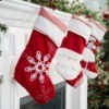 A row of Christmas stocking in red and white.