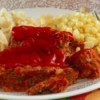 A dinner plate featuring meatloaf.