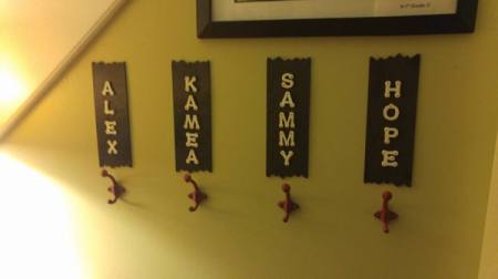 Grandkids' Coat Rack - four individual hooks on wall with child's name on a plaque over the hook