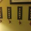 Grandkids' Coat Rack - four individual hooks on wall with child's name on a plaque over the hook