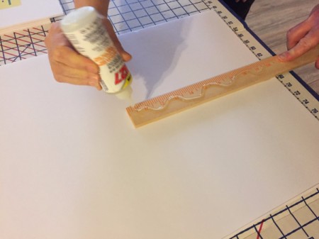 Gluing the second side of the paint stirrer.