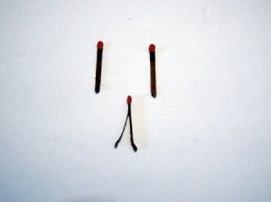A paper match split into two.