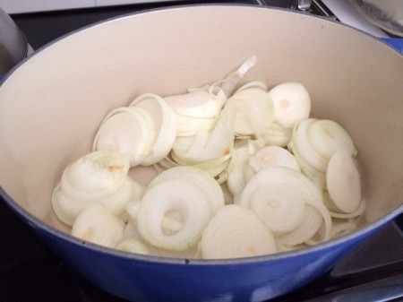 sliced onions in pan
