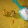 Lemon halves and powdered laundry detergent to remove a stain.