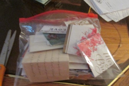 A bag full of homemade gift tags from Christmas cards.