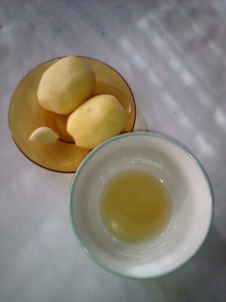 Potatoes and oil in bowls