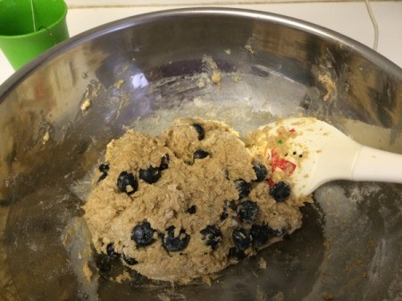 adding blueberries to batter