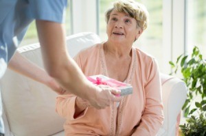 A woman getting a Mother's Day gift.