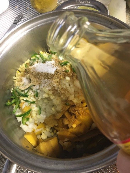 adding vinegar to pot