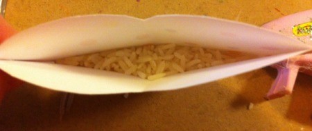 Rice Filled Paper Heart Shakers - glue the edges of the plain side of the paper hearts, leave the top open and add rice and glue closed