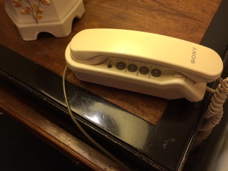 A telephone on an end table.