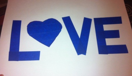 Love and Arrow Finger Paintings - cut lengths of tape to make the letters and use heart shape of the letter O