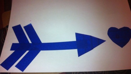 Love and Arrow Finger Paintings - stick down the heart and arrow shapes on the white paper