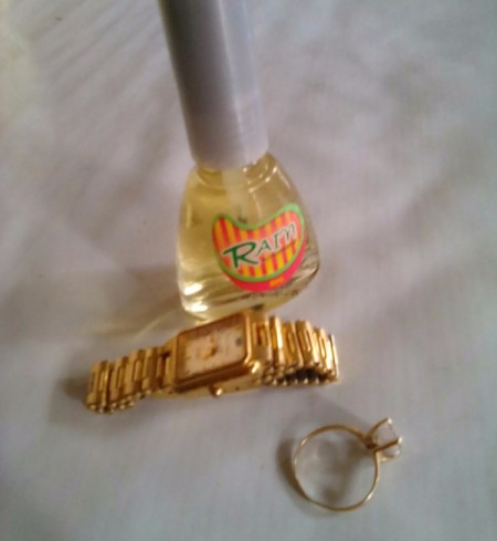 Nail Polish for Shiny Jewelry - bottle of polish, watch, and ring