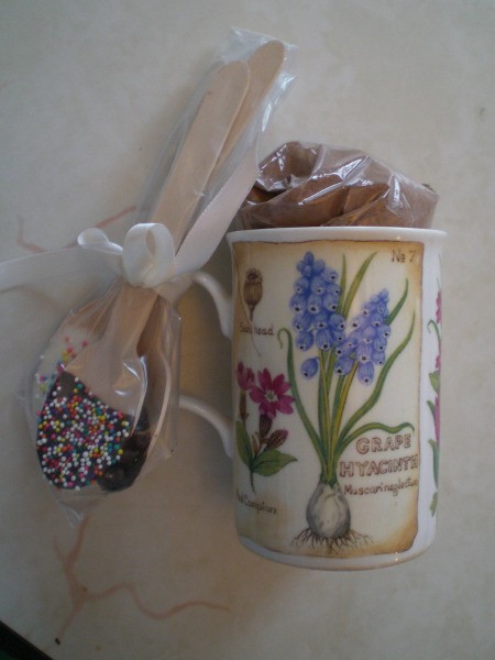 Decorated spoons tied to cup