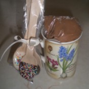 decorated chocolate spoons attached to cup